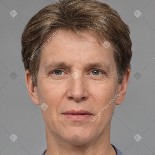 Joyful white adult male with short  brown hair and grey eyes