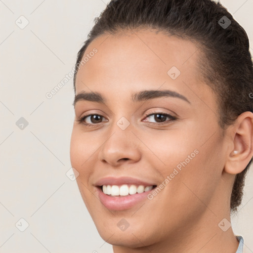 Joyful white young-adult female with short  brown hair and brown eyes