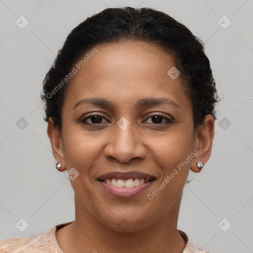 Joyful latino young-adult female with short  brown hair and brown eyes