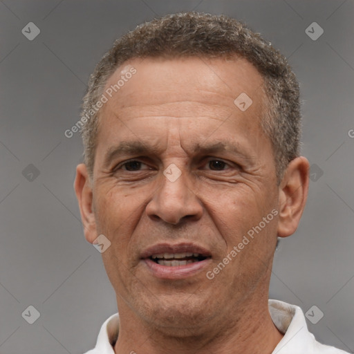 Joyful white middle-aged male with short  brown hair and brown eyes