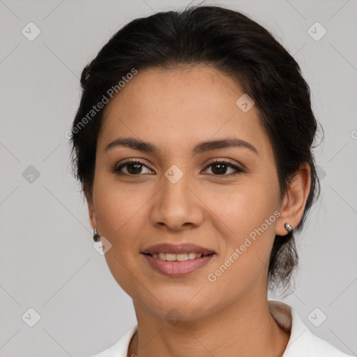 Joyful latino young-adult female with medium  brown hair and brown eyes