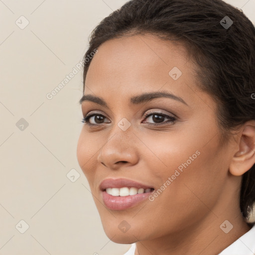 Joyful white young-adult female with long  brown hair and brown eyes