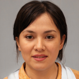 Joyful asian young-adult female with medium  brown hair and brown eyes