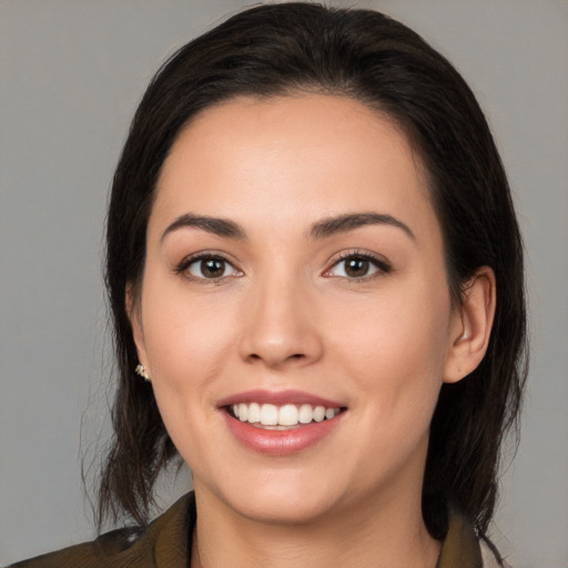 Joyful white young-adult female with medium  brown hair and brown eyes