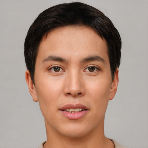 Joyful asian young-adult male with short  brown hair and brown eyes