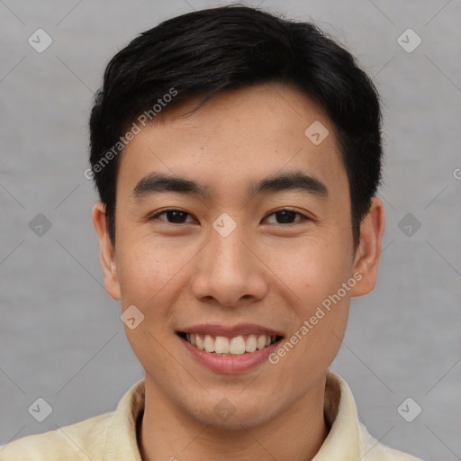 Joyful asian young-adult male with short  brown hair and brown eyes