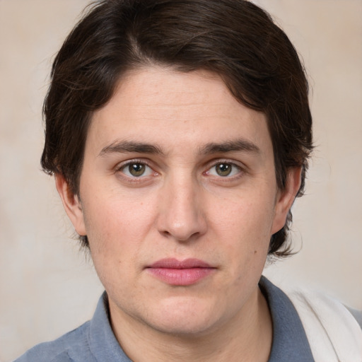 Joyful white young-adult male with medium  brown hair and brown eyes