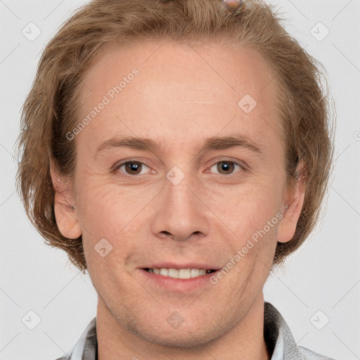 Joyful white adult male with short  brown hair and grey eyes