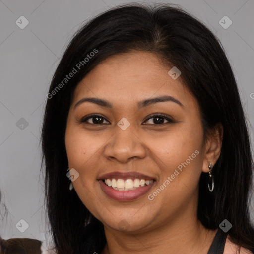 Joyful latino young-adult female with long  brown hair and brown eyes