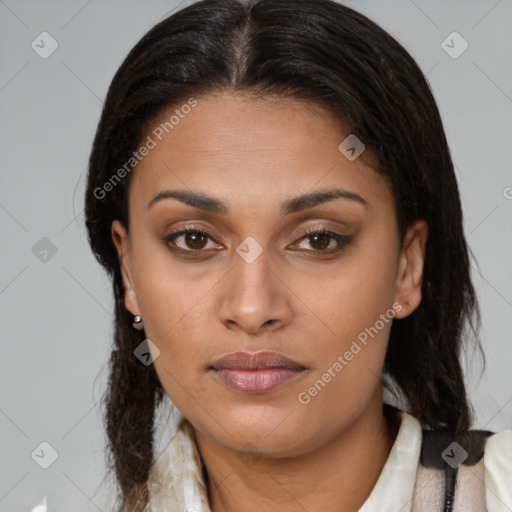 Joyful latino young-adult female with medium  brown hair and brown eyes