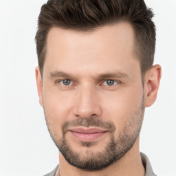 Joyful white young-adult male with short  brown hair and brown eyes