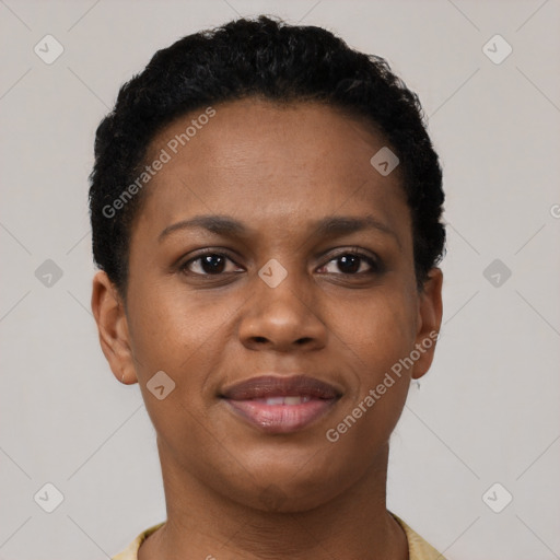 Joyful black young-adult female with short  brown hair and brown eyes