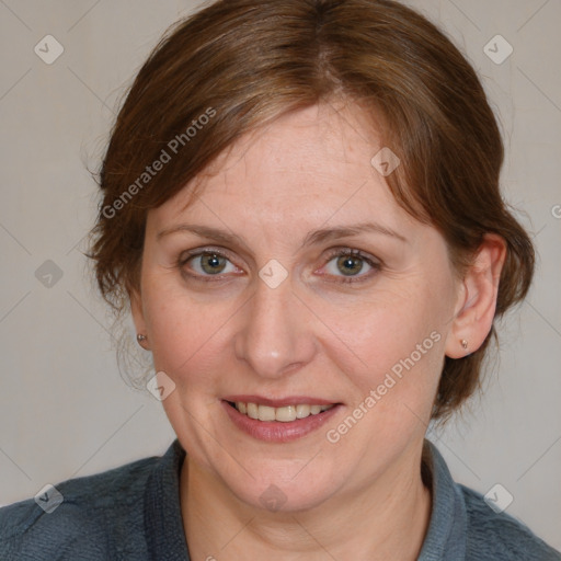 Joyful white adult female with medium  brown hair and blue eyes