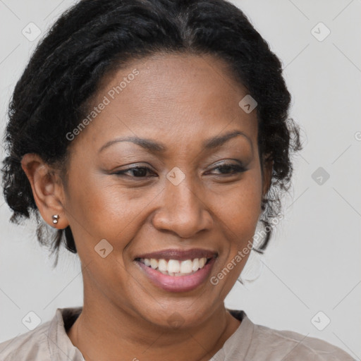 Joyful black adult female with medium  brown hair and brown eyes