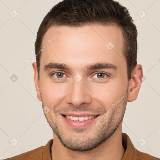 Joyful white young-adult male with short  brown hair and brown eyes