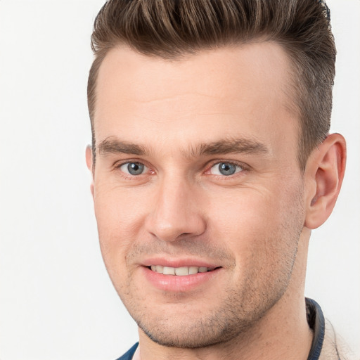 Joyful white adult male with short  brown hair and grey eyes