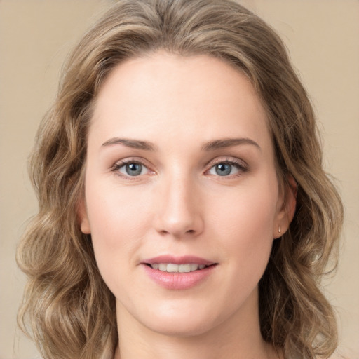 Joyful white young-adult female with long  brown hair and green eyes