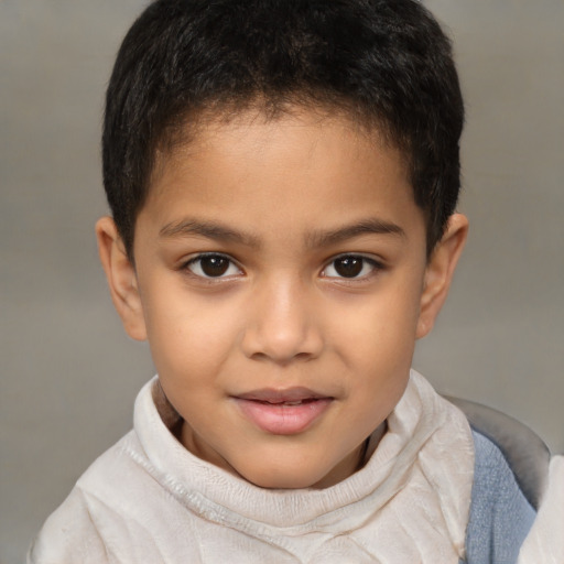 Joyful latino child male with short  brown hair and brown eyes