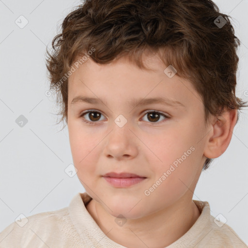 Joyful white child male with short  brown hair and brown eyes