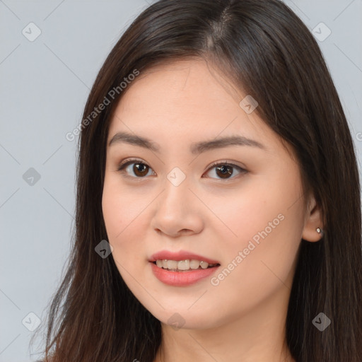 Joyful white young-adult female with long  brown hair and brown eyes