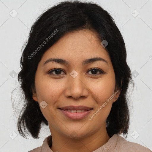 Joyful latino young-adult female with medium  brown hair and brown eyes