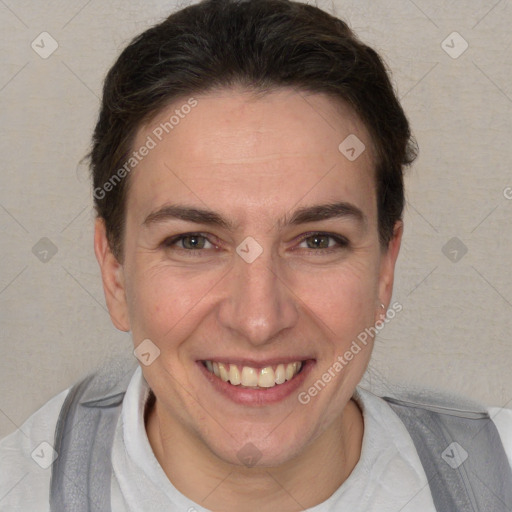 Joyful white adult female with short  brown hair and brown eyes