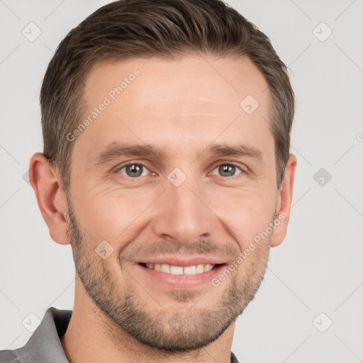 Joyful white adult male with short  brown hair and grey eyes