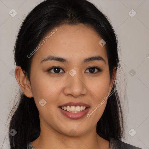 Joyful latino young-adult female with long  black hair and brown eyes