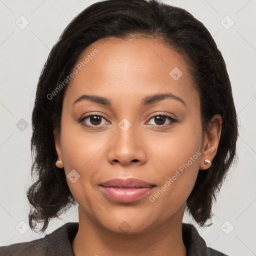 Joyful latino young-adult female with medium  brown hair and brown eyes