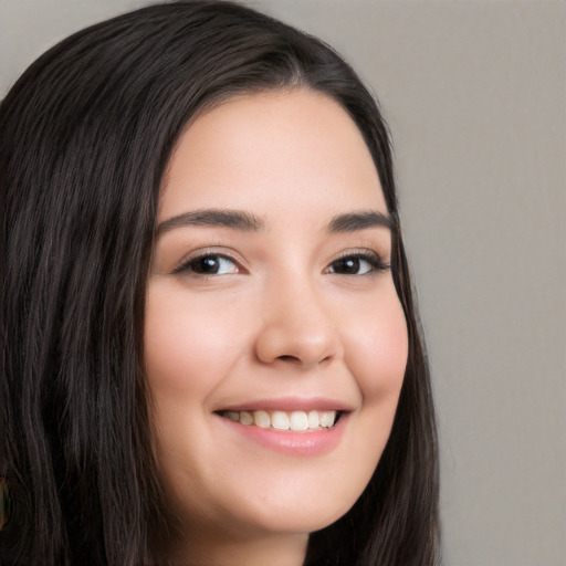 Joyful white young-adult female with long  black hair and brown eyes