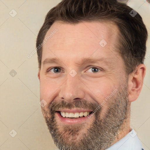 Joyful white adult male with short  brown hair and brown eyes