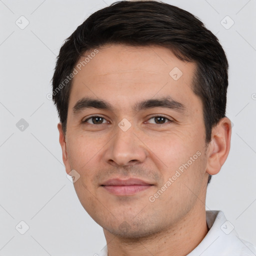 Joyful white young-adult male with short  black hair and brown eyes