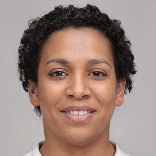 Joyful latino young-adult female with short  brown hair and brown eyes