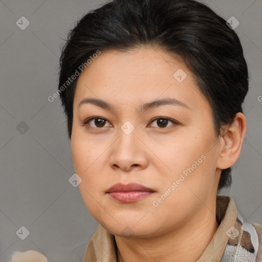 Joyful asian young-adult female with medium  brown hair and brown eyes