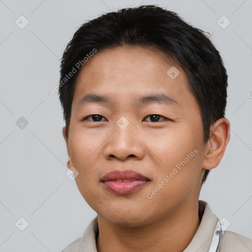 Joyful asian young-adult male with short  brown hair and brown eyes