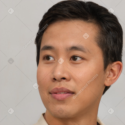 Joyful asian young-adult male with short  brown hair and brown eyes