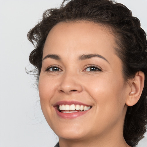 Joyful white young-adult female with medium  brown hair and brown eyes