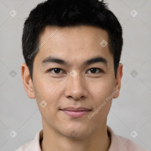 Joyful latino young-adult male with short  brown hair and brown eyes