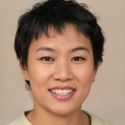 Joyful asian young-adult female with short  brown hair and brown eyes