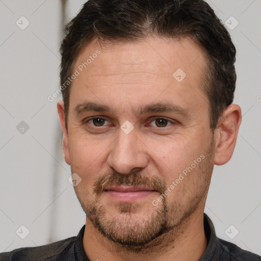 Joyful white adult male with short  brown hair and brown eyes