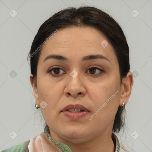 Joyful white adult female with medium  brown hair and brown eyes