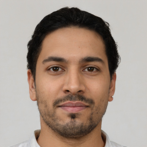 Neutral latino young-adult male with short  black hair and brown eyes