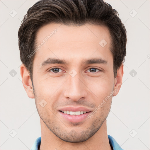 Joyful white young-adult male with short  brown hair and brown eyes