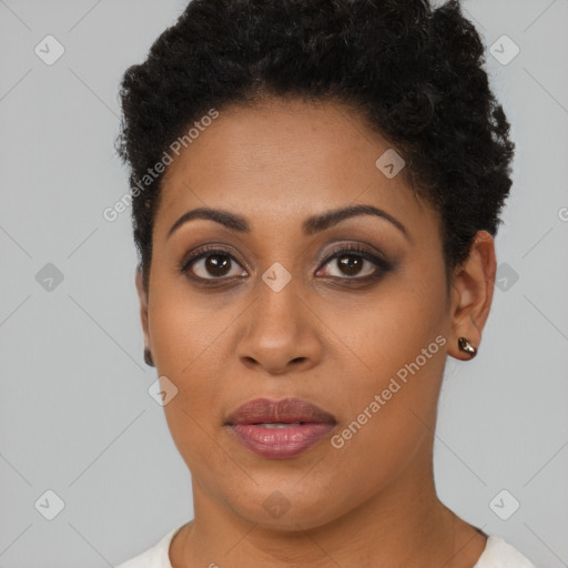 Joyful black young-adult female with short  brown hair and brown eyes