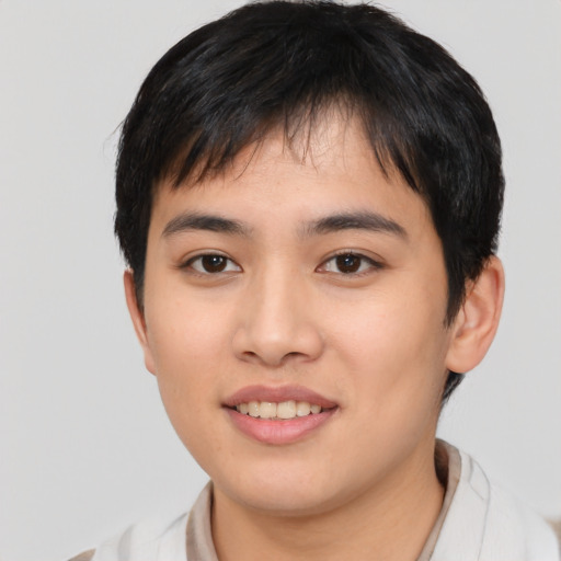 Joyful asian young-adult male with short  brown hair and brown eyes