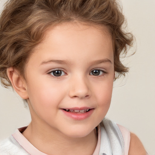 Joyful white child female with short  brown hair and brown eyes