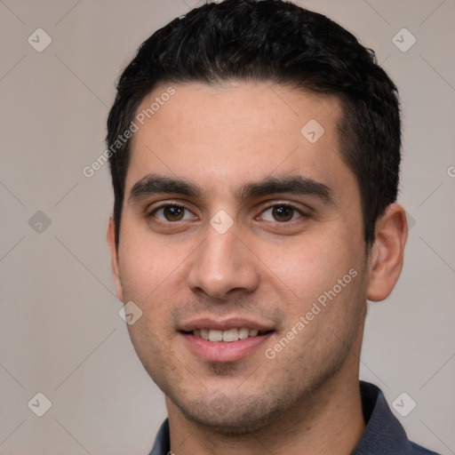 Joyful white young-adult male with short  black hair and brown eyes