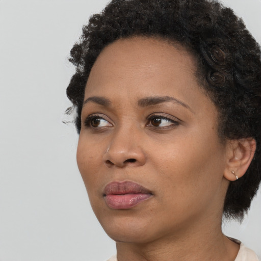 Neutral black young-adult female with short  black hair and brown eyes