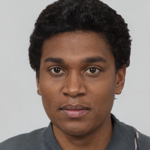 Neutral black young-adult male with short  black hair and brown eyes