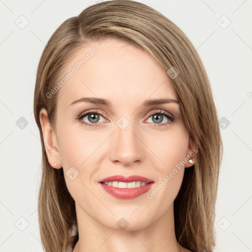 Joyful white young-adult female with long  brown hair and green eyes